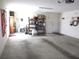 The garage is spacious and has storage shelves and room for parking at 14244 Sw 115Th Cir, Dunnellon, FL 34432