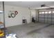 The garage has a garage door with translucent panels and plenty of room for parking at 14244 Sw 115Th Cir, Dunnellon, FL 34432