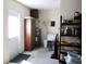 The garage is spacious and has storage shelves and a laundry sink at 14244 Sw 115Th Cir, Dunnellon, FL 34432