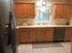 Spacious kitchen with abundant cabinets, smooth countertops, and practical appliance setup at 14244 Sw 115Th Cir, Dunnellon, FL 34432
