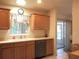 Functional kitchen space offering ample countertop area and a view into the dining area at 14244 Sw 115Th Cir, Dunnellon, FL 34432