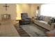 Spacious living room with a comfortable seating area, rug, and tile flooring at 14244 Sw 115Th Cir, Dunnellon, FL 34432