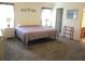 Large bedroom features plush carpeting and twin bedside tables with lamps at 14244 Sw 115Th Cir, Dunnellon, FL 34432