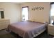 Spacious main bedroom features carpeting, bedside tables with lamps, and natural light at 14244 Sw 115Th Cir, Dunnellon, FL 34432
