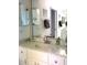 Bathroom vanity featuring neutral paint, framed mirrors, and decorative accents at 18956 Sw 93Rd Loop, Dunnellon, FL 34432