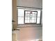 Window featuring a stained glass design, located next to the bathtub at 18956 Sw 93Rd Loop, Dunnellon, FL 34432