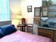 Bedroom showcases vintage furnishings including a bed, desk, and various decorative pieces at 18956 Sw 93Rd Loop, Dunnellon, FL 34432