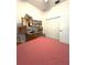 Bedroom featuring neutral walls and carpet, a closet, and vintage furnishings at 18956 Sw 93Rd Loop, Dunnellon, FL 34432