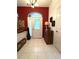 Spacious foyer boasting tile flooring, a glass front door, and elegant accents at 18956 Sw 93Rd Loop, Dunnellon, FL 34432