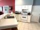 Bright and airy kitchen equipped with stainless steel appliances and ample counter space at 18956 Sw 93Rd Loop, Dunnellon, FL 34432