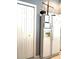 A kitchen featuring an old style refrigerator with an ice maker and water dispenser next to the pantry at 18956 Sw 93Rd Loop, Dunnellon, FL 34432