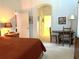 The main bedroom features access to the bathroom and a vanity on the opposite side at 18956 Sw 93Rd Loop, Dunnellon, FL 34432