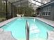 Sparkling pool with screen enclosure for year-round enjoyment and a beautiful outdoor space for leisure and gatherings at 18956 Sw 93Rd Loop, Dunnellon, FL 34432