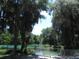 Community waterfront featuring beautiful clear water and lush, mature landscaping at 18956 Sw 93Rd Loop, Dunnellon, FL 34432