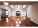 Spacious living room features hardwood floors, fireplace, and skylights for natural light at 1951 Se 37Th Court Cir, Ocala, FL 34471