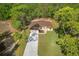 Aerial view of the property featuring a well-manicured lawn and beautiful surroundings at 19939 Sw 96Th Pl, Dunnellon, FL 34432
