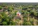 An aerial view of a home nestled among mature trees, creating a private and serene setting at 19939 Sw 96Th Pl, Dunnellon, FL 34432
