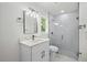 Modern bathroom with glass shower and vanity with white countertops at 19939 Sw 96Th Pl, Dunnellon, FL 34432