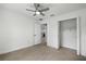 Bright bedroom with a ceiling fan and a spacious closet offering ample storage at 19939 Sw 96Th Pl, Dunnellon, FL 34432