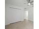 Bright bedroom with a ceiling fan and a spacious closet offering ample storage at 19939 Sw 96Th Pl, Dunnellon, FL 34432