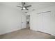 Bright bedroom with a ceiling fan and a spacious closet offering ample storage at 19939 Sw 96Th Pl, Dunnellon, FL 34432