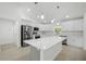 Spacious kitchen features white cabinets, stainless steel appliances, and center island at 19939 Sw 96Th Pl, Dunnellon, FL 34432