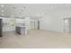 Spacious kitchen with white cabinets, a gray island, and stainless steel appliances at 19939 Sw 96Th Pl, Dunnellon, FL 34432