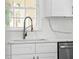 Modern kitchen sink and countertop with white cabinets, offering a clean aesthetic at 19939 Sw 96Th Pl, Dunnellon, FL 34432