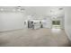 Spacious open-concept living area with kitchen, modern appliances, and backyard access at 19939 Sw 96Th Pl, Dunnellon, FL 34432