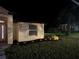 Nighttime exterior view with landscape lighting at 19939 Sw 96Th Pl, Dunnellon, FL 34432