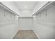 Empty walk-in closet with neutral paint, floors, and basic shelving at 19939 Sw 96Th Pl, Dunnellon, FL 34432