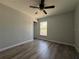 Bedroom featuring luxury vinyl plank flooring, a window with natural light, and neutral paint colors at 20652 Sw Cardinal Ave, Dunnellon, FL 34431