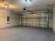 Spacious garage features an insulated garage door, epoxy flooring, and an electrical panel at 20652 Sw Cardinal Ave, Dunnellon, FL 34431