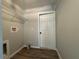 Functional laundry room with wood-look floors and wire shelving for convenient storage solutions at 20652 Sw Cardinal Ave, Dunnellon, FL 34431