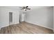 Spacious bedroom with ceiling fan, wood-look flooring, and ample closet space at 207 Juniper Loop Cir, Ocala, FL 34480