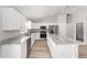 Bright kitchen with stainless steel appliances, stone countertops and lots of cabinet space at 207 Juniper Loop Cir, Ocala, FL 34480