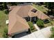 Birds eye view showing the rear of the house featuring mature landscaping, screened in pool and patio at 21884 Sw 88Th Lane Rd, Dunnellon, FL 34431
