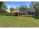 Spacious backyard featuring a screened pool enclosure, ideal for outdoor entertaining and relaxation at 21884 Sw 88Th Lane Rd, Dunnellon, FL 34431