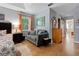 Comfortable main bedroom featuring a sitting area with a sofa and a view into the main bathroom at 21884 Sw 88Th Lane Rd, Dunnellon, FL 34431