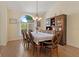 Cozy dining room features a large window that provides ample natural light and a built-in china cabinet at 21884 Sw 88Th Lane Rd, Dunnellon, FL 34431