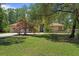 Charming single-story home featuring a lush front yard, mature trees, and inviting curb appeal at 21884 Sw 88Th Lane Rd, Dunnellon, FL 34431