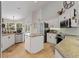 Bright kitchen with stainless steel appliances, granite countertops, island, and white cabinets offering ample storage at 21884 Sw 88Th Lane Rd, Dunnellon, FL 34431