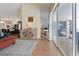 Open-concept layout showcasing the living room, dining area, and a glimpse of the kitchen with sliding door access at 21884 Sw 88Th Lane Rd, Dunnellon, FL 34431