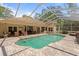 Beautiful in ground swimming pool with brick surround, screened enclosure and an outdoor seating area at 21884 Sw 88Th Lane Rd, Dunnellon, FL 34431