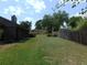 Expansive backyard with lush green grass and tall privacy fence bordering the property at 2865 Se 37Th St, Ocala, FL 34471