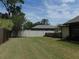 Well-maintained lawn in a partially fenced backyard with lush green grass at 2865 Se 37Th St, Ocala, FL 34471