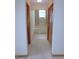 Hallway leading to bathroom with tub and linen closet at 2865 Se 37Th St, Ocala, FL 34471