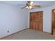 Bedroom featuring a closet, carpet, and ceiling fan at 2865 Se 37Th St, Ocala, FL 34471