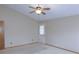 Bedroom with neutral carpet, fan and door to exterior at 2865 Se 37Th St, Ocala, FL 34471
