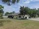 Charming single-story home featuring a manicured lawn and attached two-car garage at 2865 Se 37Th St, Ocala, FL 34471